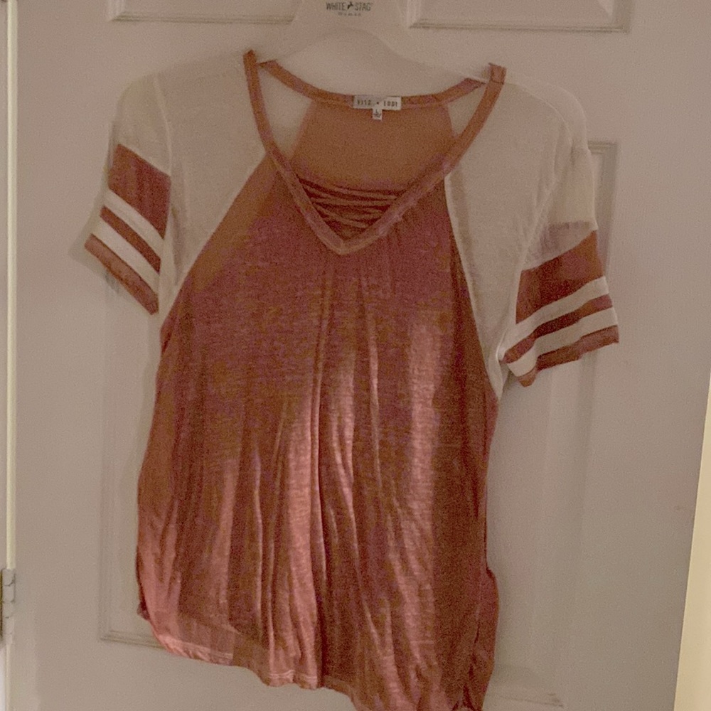 Tee with straps across chest.